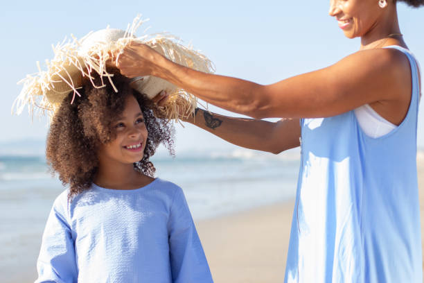 istock Smiling mother and daughter spending time on beach 1441679655