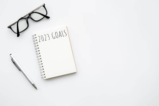 istock Notebook with 2023 goals text on it to apply new year resolutions and plan. 1441683763