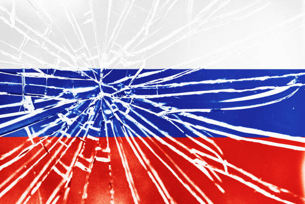Flag of Russia behind shattered glass with radiating cracks stock photo