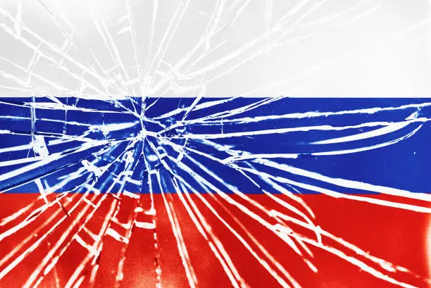 The cracks are showing: national flag of Russia behind broken glass, with heavy grain and other distressed elements.