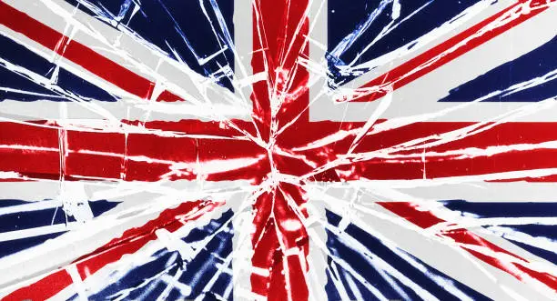 The cracks are showing: national flag of the United Kingdom, the Union Jack, behind broken glass, with heavy grain and other distressed elements.
