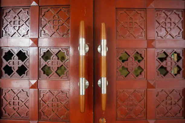 Photo of Islamic carved door in the mosque in Al Faruq Mosque, Sangatta, East Kalimantan, Indonesia.