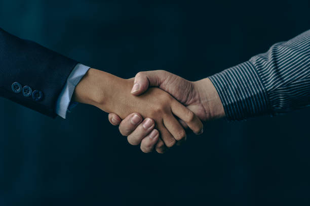 Handshake greeting or business cooperation, business deal concept stock photo