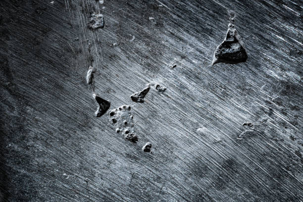 Close up of curved brushed metal surface.