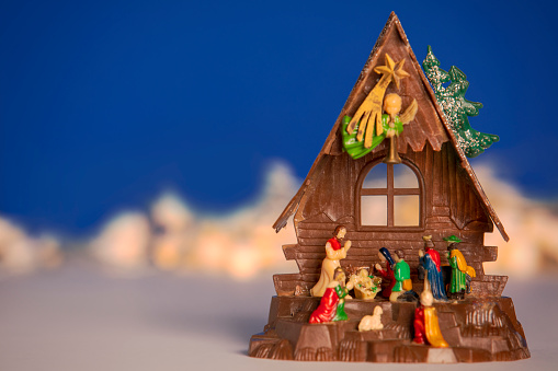 wood home toy made from wooden stick on green grass field