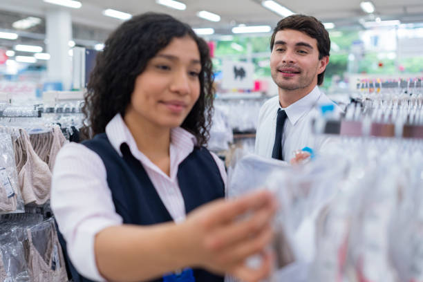 istock Warehouse manager trains his employees while showing them around the warehouse 1441689329
