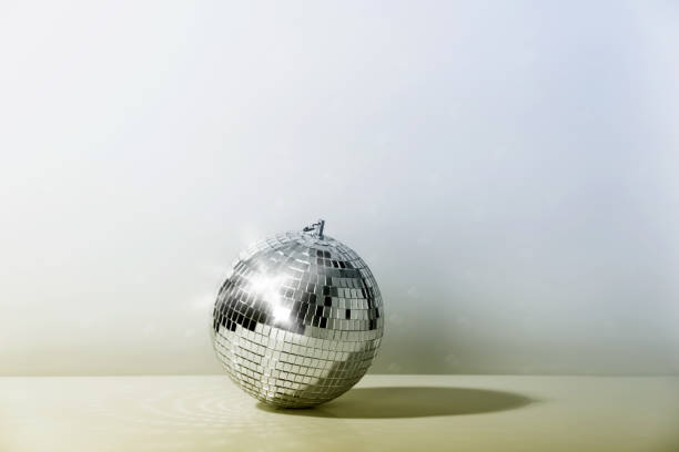 istock Disco ball on vintage styled background. Minimalistic stylish concept. 1441689719