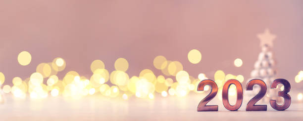 istock Metal numbers 2023 on table with bokeh lights. 1441691189