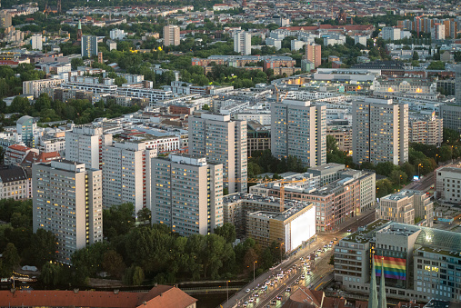 A group of apartment towers in Berlin, photographed from above at dusk.