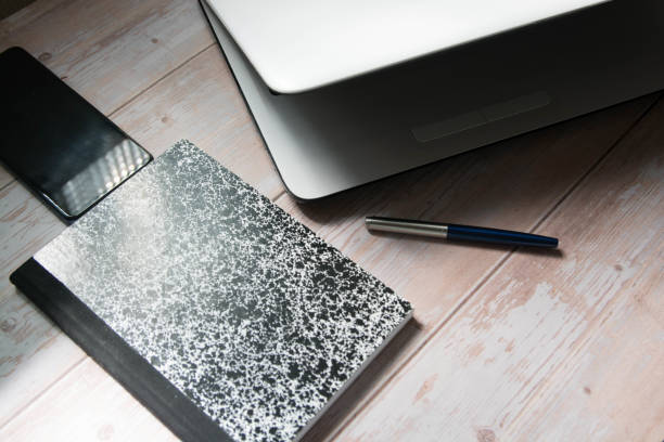 istock Desktop With Laptop, Pen, Bloc And Mobile 1441695136