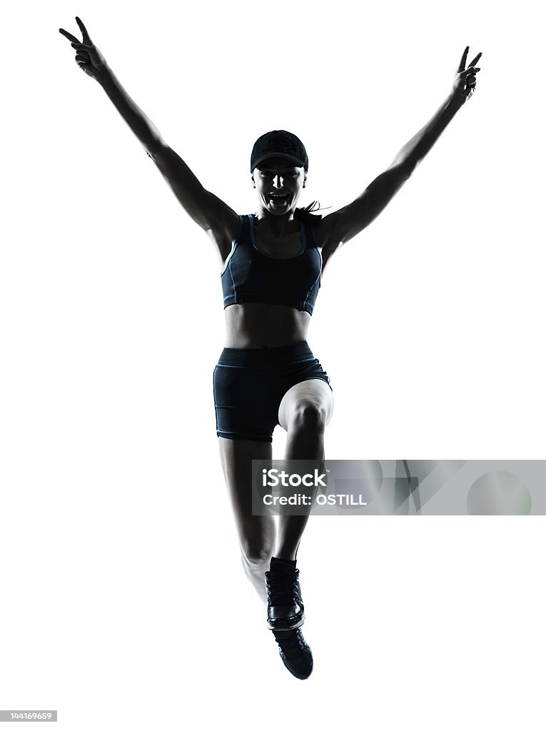 Mulher de corredor jogger Saltar vitoriosa - Royalty-free Adulto Foto de stock