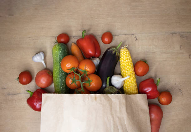 istock Assortment of fresh vegetables on rustic wooden table 1441697696