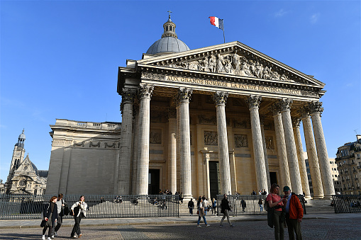 Paris, France-10 04 2022: People in front of the Pantheon. The Pantheon is a building in the Latin Quarter in Paris, France, was originally built as a church, now functions as a secular mausoleum containing the remains of distinguished French citizens.