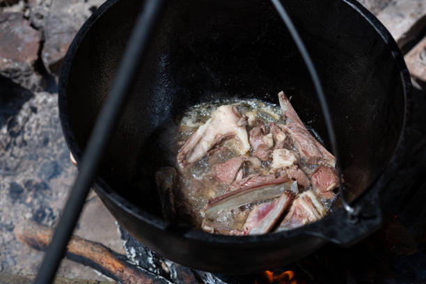 istock Cooking meat on ribs in a cauldron 1441699611