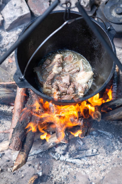 istock Cooking meat on ribs in a cauldron 1441699648