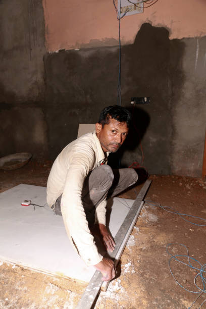 istock Mason measuring granite marble on construction site 1441701243