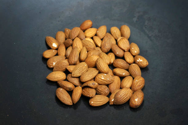 istock Roast almond peanut on a black skillet. 1441703737