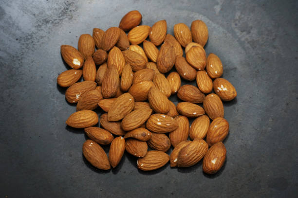 istock Roast almond peanut on a black skillet. 1441703738