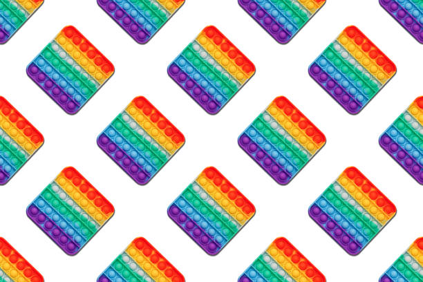 istock Pop it, Rainbow antistress toy on a white background, seamless pattern, flat lay. 1441705391