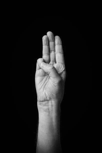 istock Hand demonstrating the Arabic sign language letter 'Tha' 1441706970