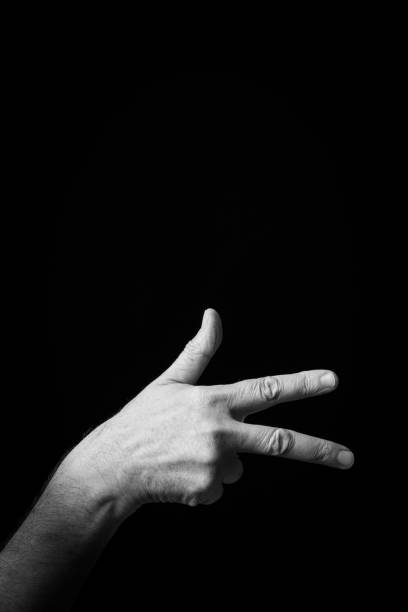 istock Hand demonstrating the Arabic sign language letter 'Ghayn' 1441707256