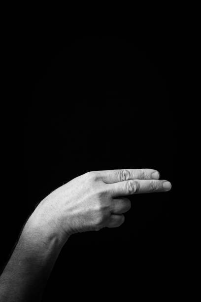 istock Hand demonstrating the Arabic sign language letter 'Ayn' 1441707257