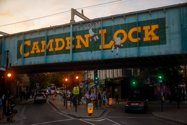 Camden town High street with iconic railway bridge at sunset September 14, 2022: London, Camden town High street with iconic railway bridge at sunset camden market stock pictures, royalty-free photos & images