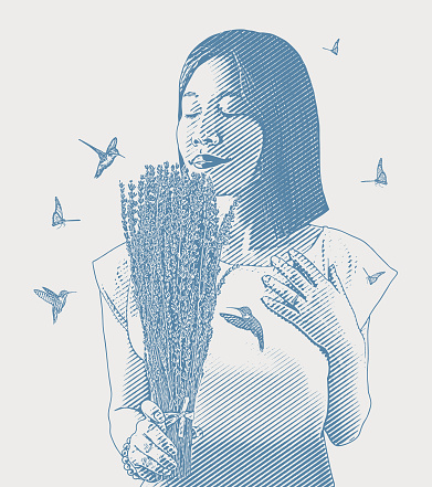 Asian woman smelling lavender flowers with butterflies and hummingbirds