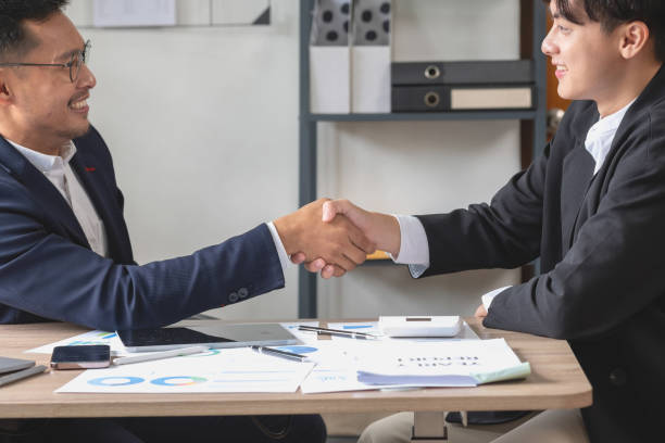 istock two business men shake hands for business cooperation 1441708598