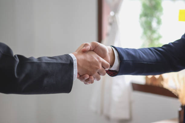 istock two business men shake hands for business cooperation 1441709085