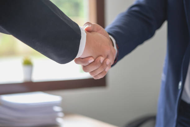 istock two business men shake hands for business cooperation 1441709191