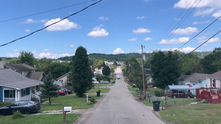 Car View of Driving by Houses in Knoxville, Tennessee on a Sunny Day