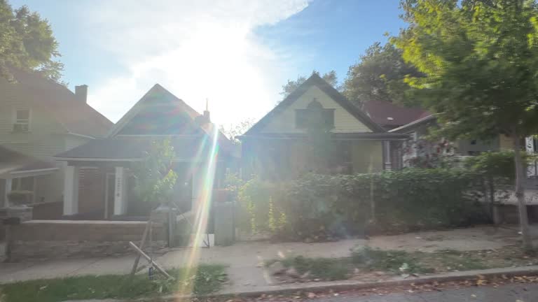 Side Car Point of View Shot of Driving Past Houses in Kansas City, Missouri on a Clear, Sunny Day