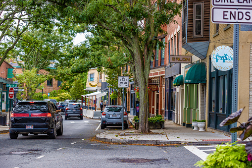Gloucester, Massachusetts, USA,  - September 13, 2022: Downtwon street lines with trees and businesses.
