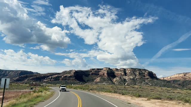Car Point of View Shot of Driving Toward the Colorado National Monument in Grand Junction, Colorado on a Bright, Sunny Day