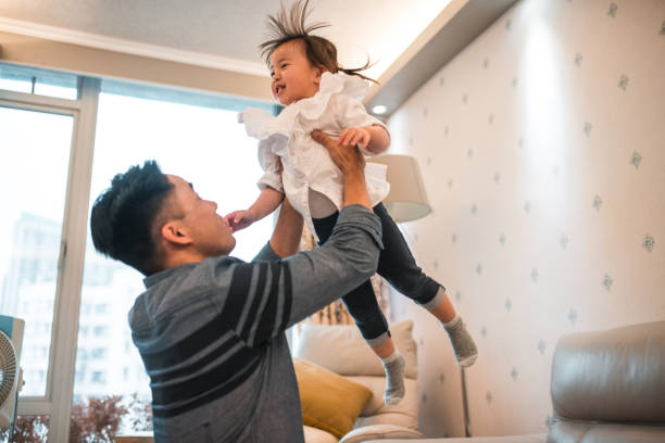 istock Joyful Single Father Playing With His Little Daughter At Home 1441715657