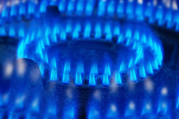 Blue fire gas stove with selective focus Blue fire gas stove with selective focus karman stock pictures, royalty-free photos & images