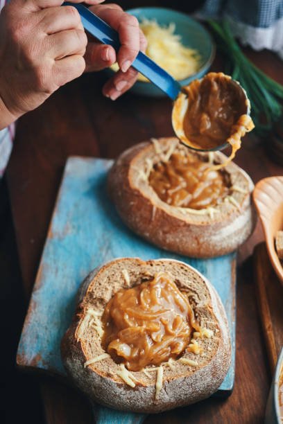istock Preparing French Onion Bread Bowl in Domestic Kitchen 1441717655
