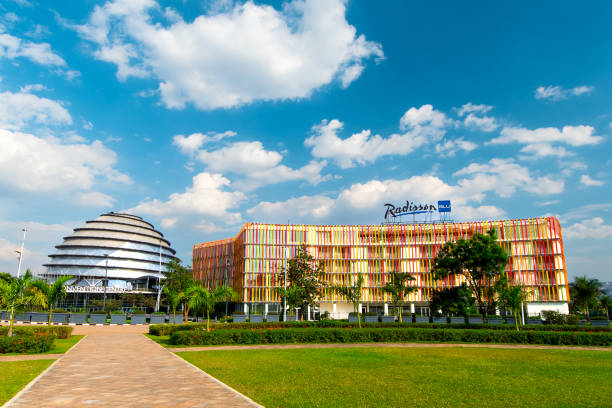 Kigali Convention Centre and Radisson Blu hotel on a sunny day Kigali, Rwanda - August 19 2022: Kigali Convention Centre and Radisson Blu hotel on a sunny day. The facility, designed after the inside of a king's palace, is able to host a variety of events kigali convention center stock pictures, royalty-free photos & images