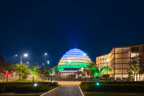 Kigali Convention Centre lit up in the colors of the Rwandan flag Kigali, Rwanda - August 19 2022: Kigali Convention Centre lit up in the colors of the Rwandan flag. The facility, designed after the inside of a king's palace, is able to host a variety of events kigali convention center stock pictures, royalty-free photos & images