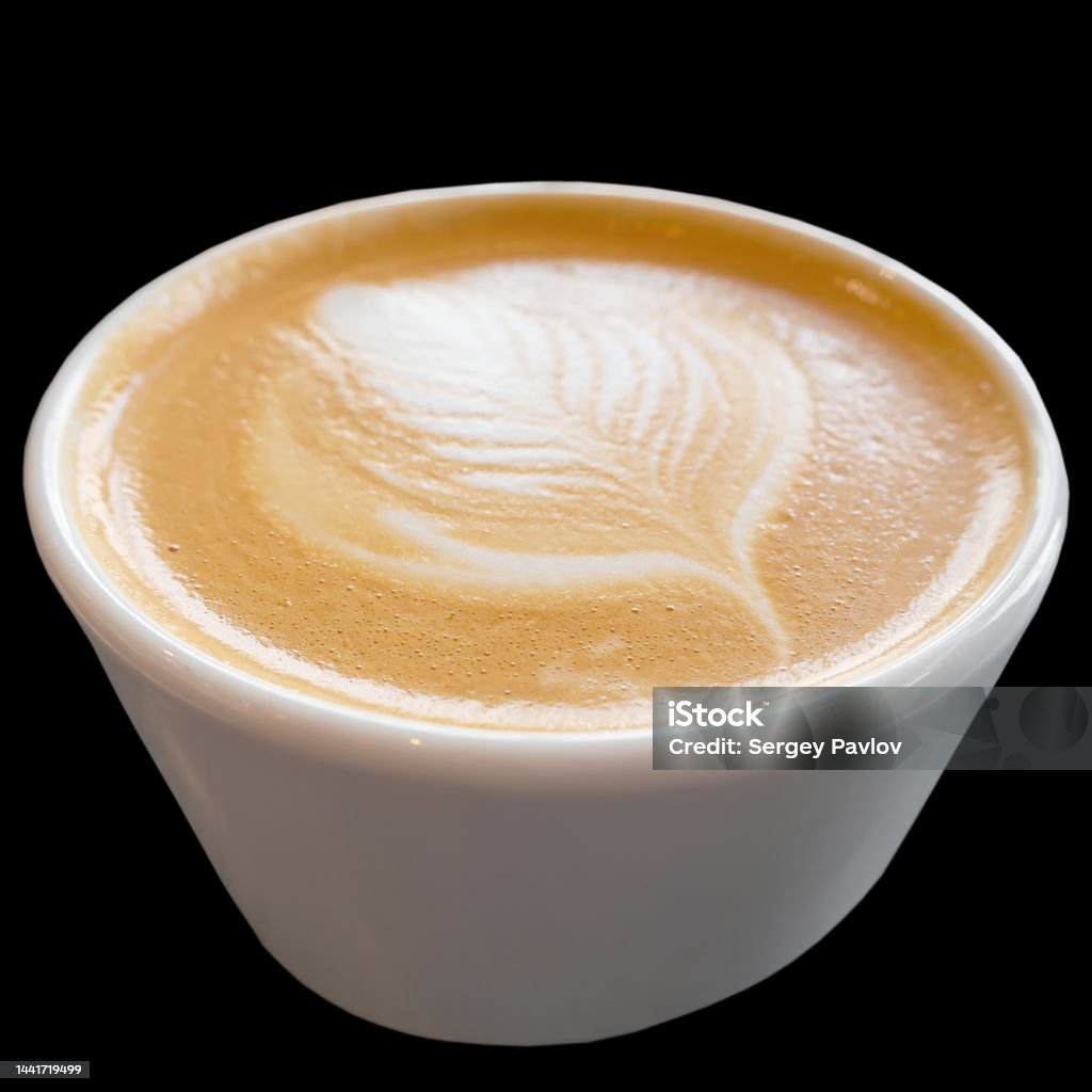 a cup of cappuccino coffee with a pattern on the foam cup of cappuccino coffee with a pattern on the crema isolated on a black background Art Stock Photo