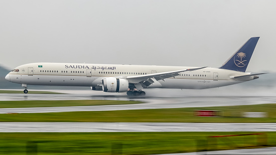 Manchester Airport, United Kingdom - 21 October, 2022: Saudia Arabia Boeing 787 (HZ-AR25) touching down on runway 05L from Jeddah, Saudia Arabia.