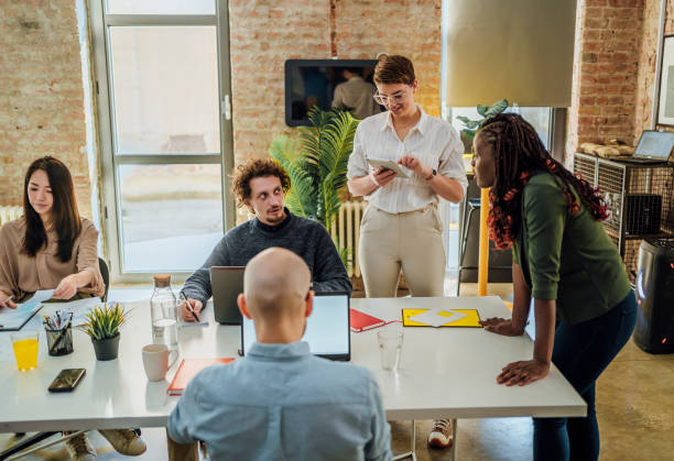 istock Young people having a business meeting 1441722137