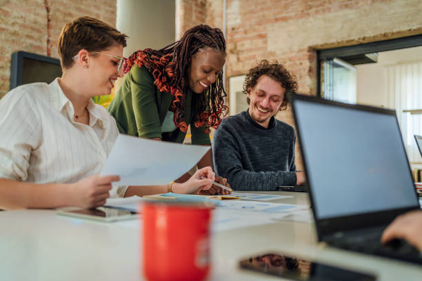 istock Group of young people discussing a new project 1441725064