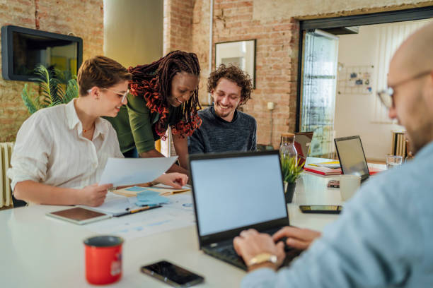 istock Group of young people discussing a new project 1441725091