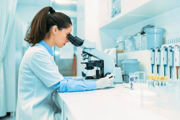 istock Young woman technician working with samples in a laboratory 1441727589
