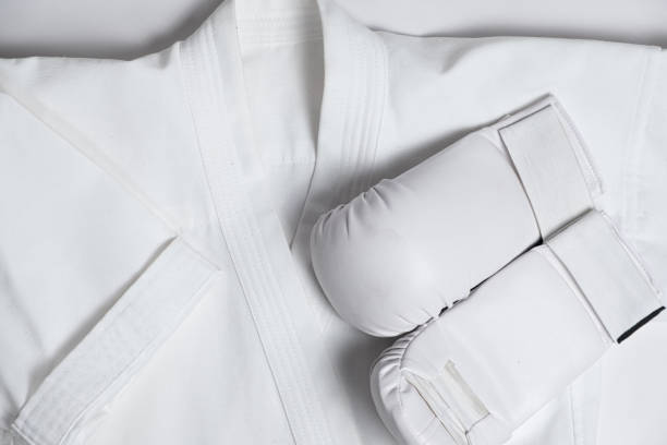 istock Kimono and white gloves for karate training for children, top view 1441728120