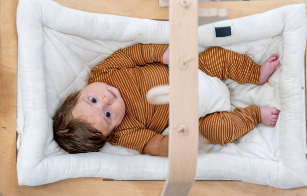 istock Infant Focusing on a Mobile 1441728282