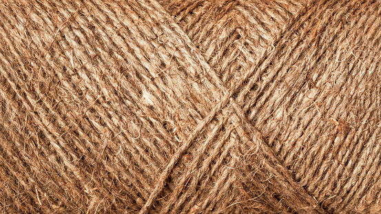 Brown rope texture pattern closeup. Coarse threads, vintage background