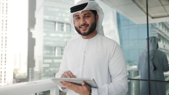 Arab Businessman Using Digital Tablet In The Office